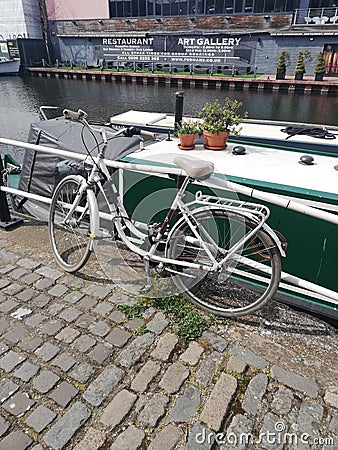 Pretty bike next to a boat Editorial Stock Photo