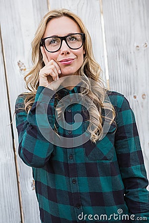 Pretty blonde thinking with on head Stock Photo
