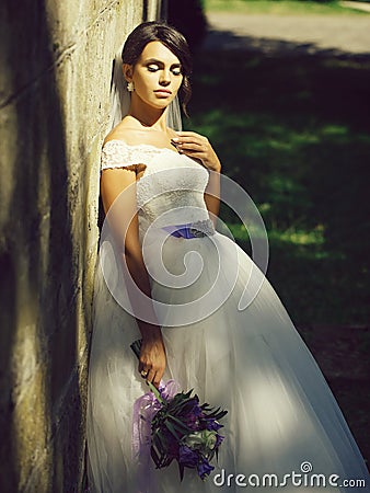 Pretty bride with flower bouquet Stock Photo