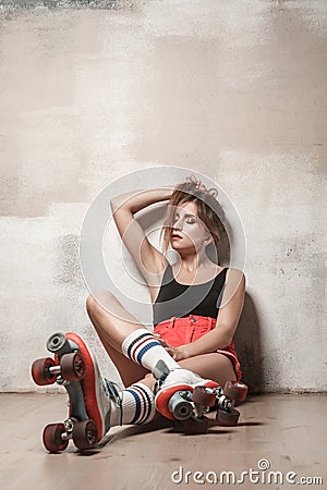 Pretty brunette girl relax, sitting on the floor in quads. Stock Photo