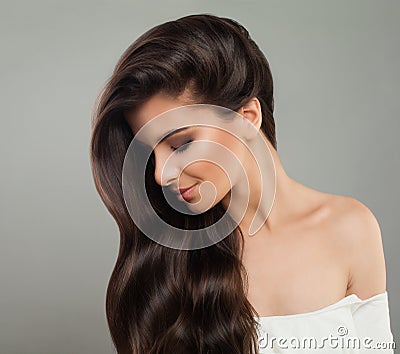 Pretty brunette woman with wavy hairstyle. Beautiful female profile. Hair care concept Stock Photo