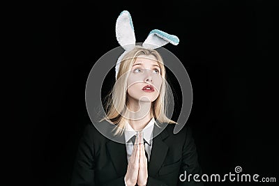 Pretty bunny girl winking and tongue out. Sexy blonde girl with lace bunny ears. Woman rabbit easter bunny girl. Lovely Stock Photo