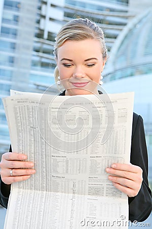 Pretty Business Woman Reading Newspaper Stock Photo