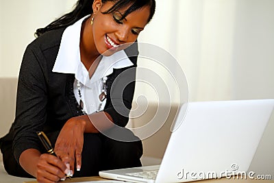 Pretty businesswoman on black suit working Stock Photo