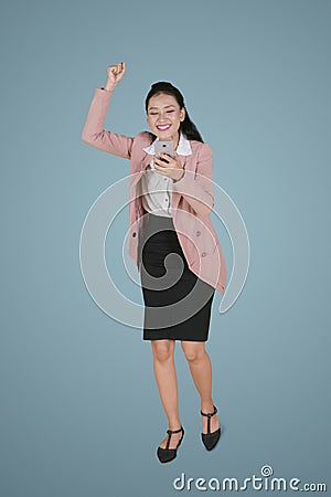 Pretty businesswoman expressing her success Stock Photo