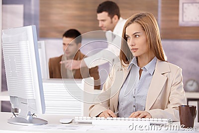 Pretty businesswoman working on computer Stock Photo