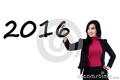 Pretty businesswoman writing numbers 2016 Stock Photo