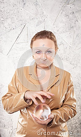 Pretty caucasian woman with her hands with crystal ball predicting the future on white background Stock Photo