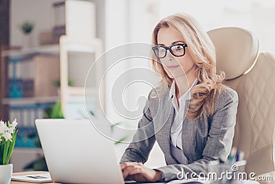 Pretty, charming, blonde woman using netbook Stock Photo