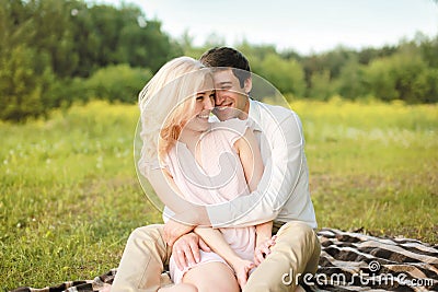 Pretty cheerful couple on picnic Stock Photo