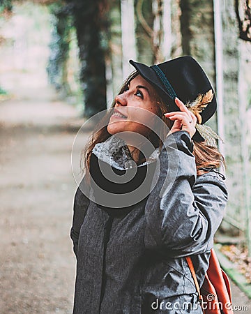 Pretty cheerful girl in the garden with bavarian hat. Stock Photo