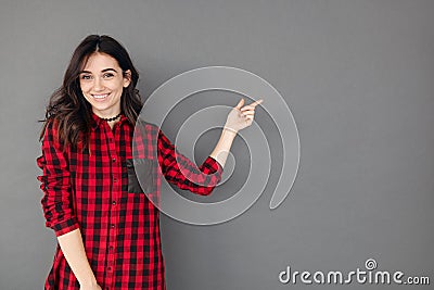 Pretty cheerful woman gesturing with finger away Stock Photo