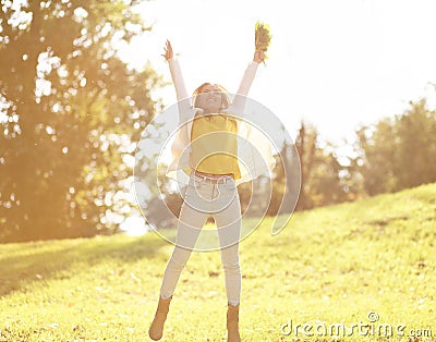 Pretty cheerful woman having fun in sunny autumn day Stock Photo