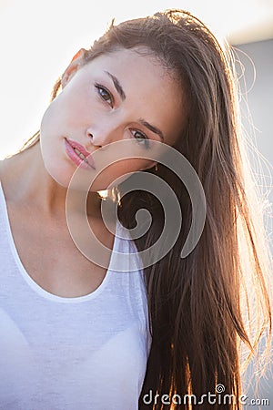 Pretty city girl portrait at sunset backlight closeup Stock Photo