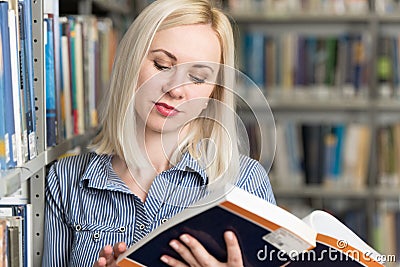 Pretty College Student in a Library Stock Photo