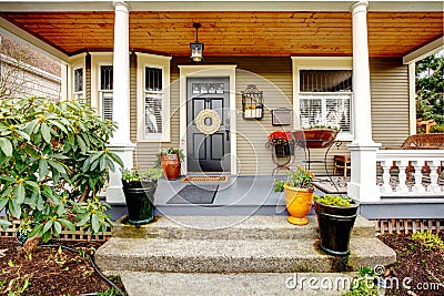 Pretty column porch with wooden ceiling Stock Photo