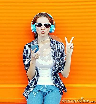 Pretty cool girl having fun and listens to music Stock Photo