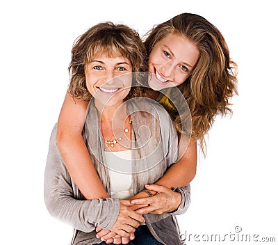 Pretty daughter hugging her mom from back Stock Photo