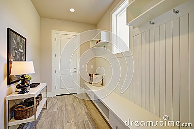 Pretty entrance foyer with an extra long built-in bench Stock Photo