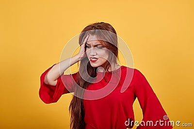 Pretty European woman over isolated wall showing heavy headache Stock Photo