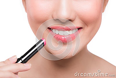 Pretty face beauty lady applying lipstick. Beautiful girl makes Stock Photo