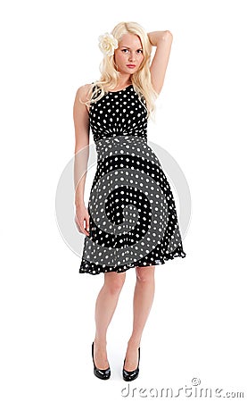 Pretty female in polker dot dress isolated Stock Photo