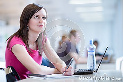 Pretty female student with laptop Stock Photo