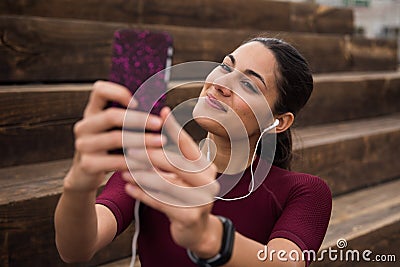 Pretty fitness brunette taking a selfie Stock Photo