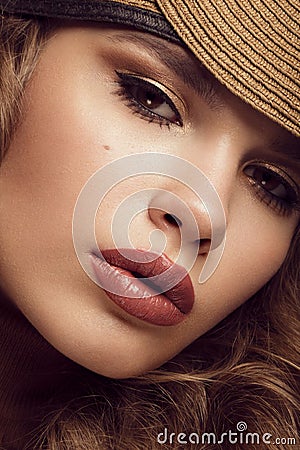 Pretty fresh girl, image of modern Twiggy in fashionable brown hat, with unusual eyelashes and curls. Stock Photo