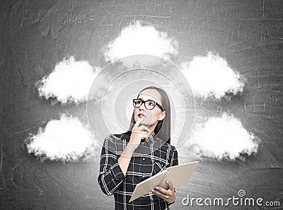 Pretty geek girl in glasses, thought clouds Stock Photo