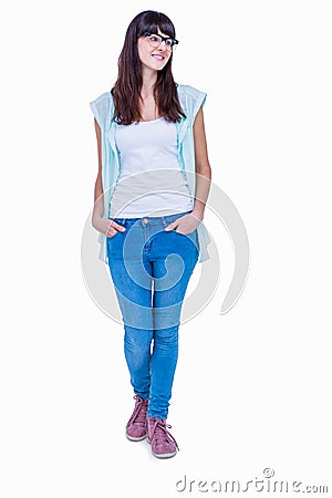 Pretty geeky hipster with hands in pocket looking away Stock Photo