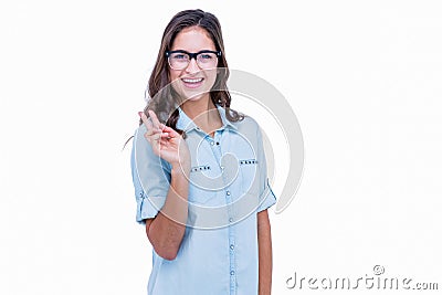 Pretty geeky hipster making peace sign Stock Photo