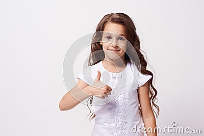 Pretty Girl. Dark curly hair. Gesture approval Stock Photo