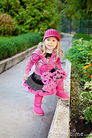 Pretty girl dressed in pink clothes Stock Photo