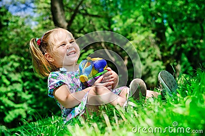 Pretty girl holding new toys for sandbox outdoor Stock Photo
