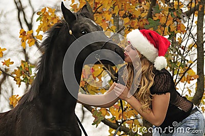 Pretty girl kissing a horse Stock Photo