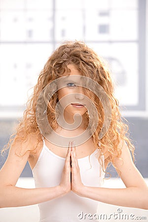 Pretty girl practicing yoga prayer pose Stock Photo