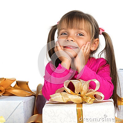 Pretty girl with present near the Christmas tree Stock Photo