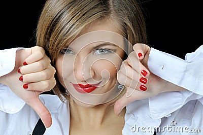 Pretty girl shows tumbs down Stock Photo