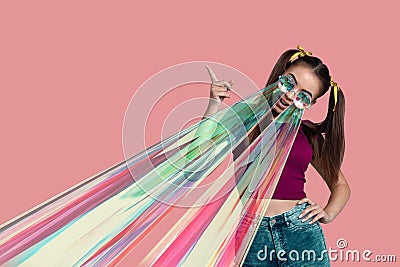 Pretty girl in a T-shirt and wearing kaleidoscope glasses with rays from the eyes Stock Photo