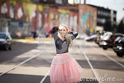 Pretty girl walking down the street Stock Photo