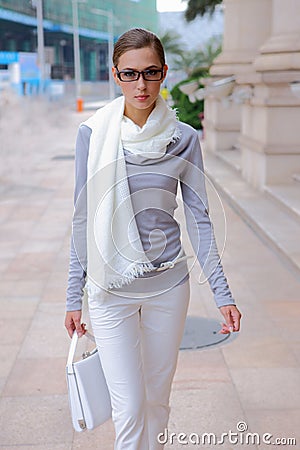 Pretty girl walking on street Stock Photo