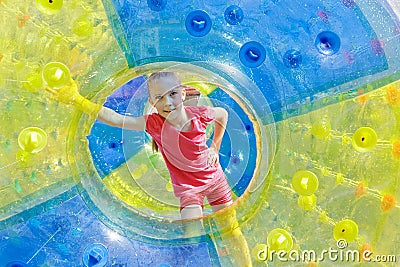 Pretty girl in water-roller Stock Photo