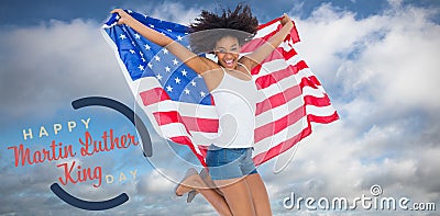 Composite image of pretty girl wrapped in american flag jumping and smiling at camera Editorial Stock Photo