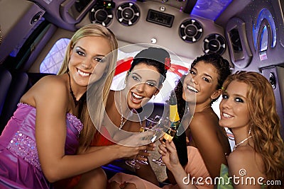 Pretty girls celebrating in limo Stock Photo