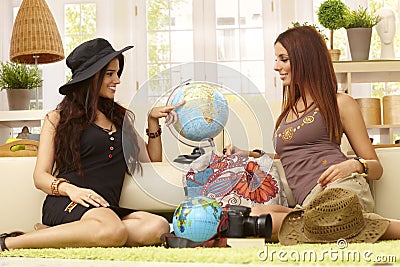 Pretty girls planning summer holiday Stock Photo