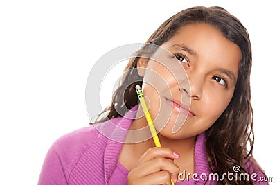 Pretty Hispanic Girl Thinking with Pencil Stock Photo