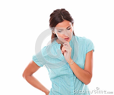 Pretty hispanic holding chin and wondering Stock Photo