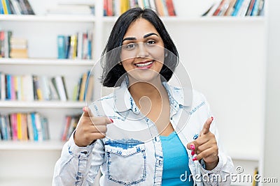 Pretty hispanic mature adult woman at home Stock Photo