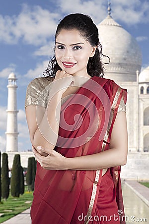 Pretty Indian woman wearing red sari clothes Stock Photo